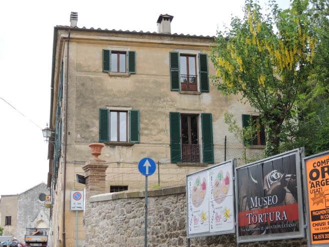 My apartment right above the Torture Museum Sign!