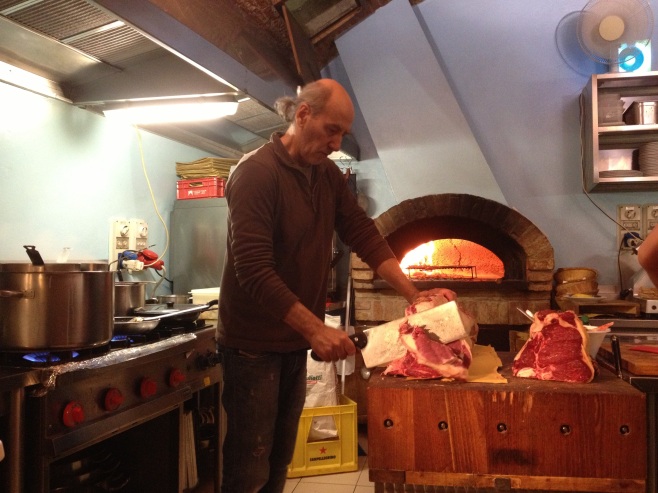 The Owner at Acquacheta Preparing the Meat